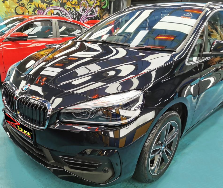 The BMW 216i from a side angle after the ceramic coating.