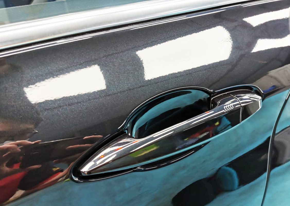 Front three-quarter view of the BMW 216i after coating.