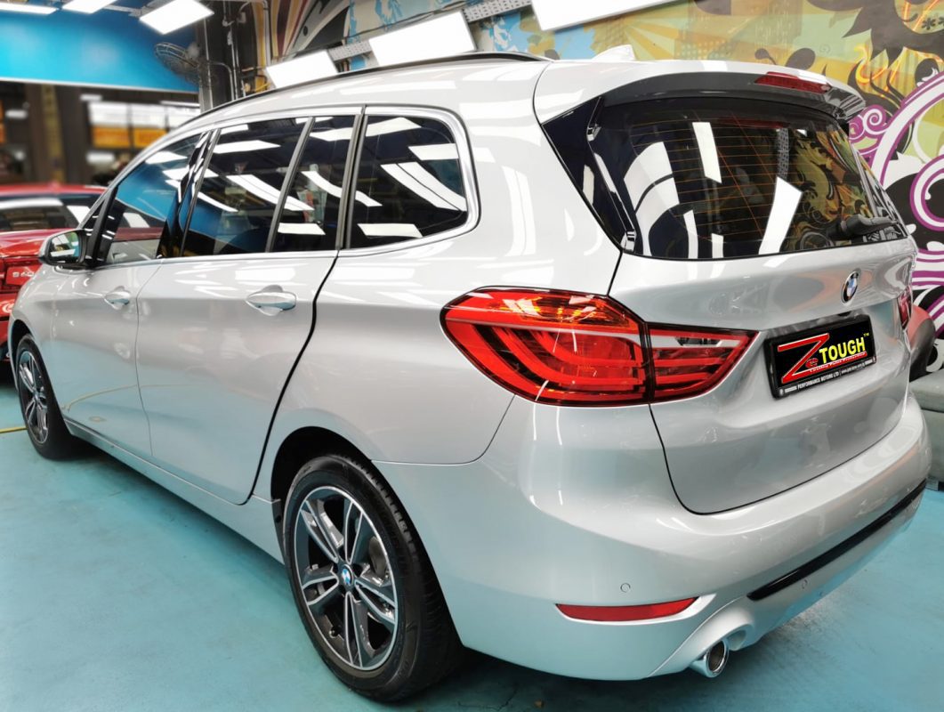 Rear quarter of the BMW 216i, glossy and protected.