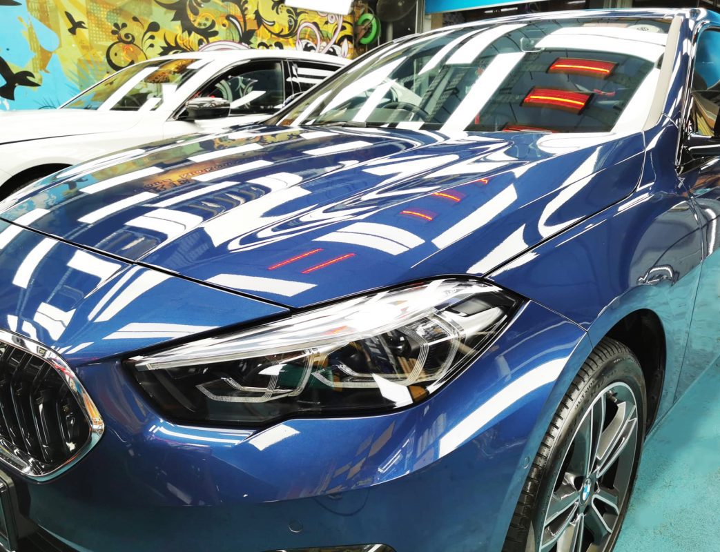 The BMW 216i from a side angle after the ceramic coating.