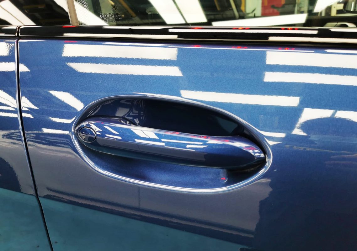 Front three-quarter view of the BMW 216i after coating.
