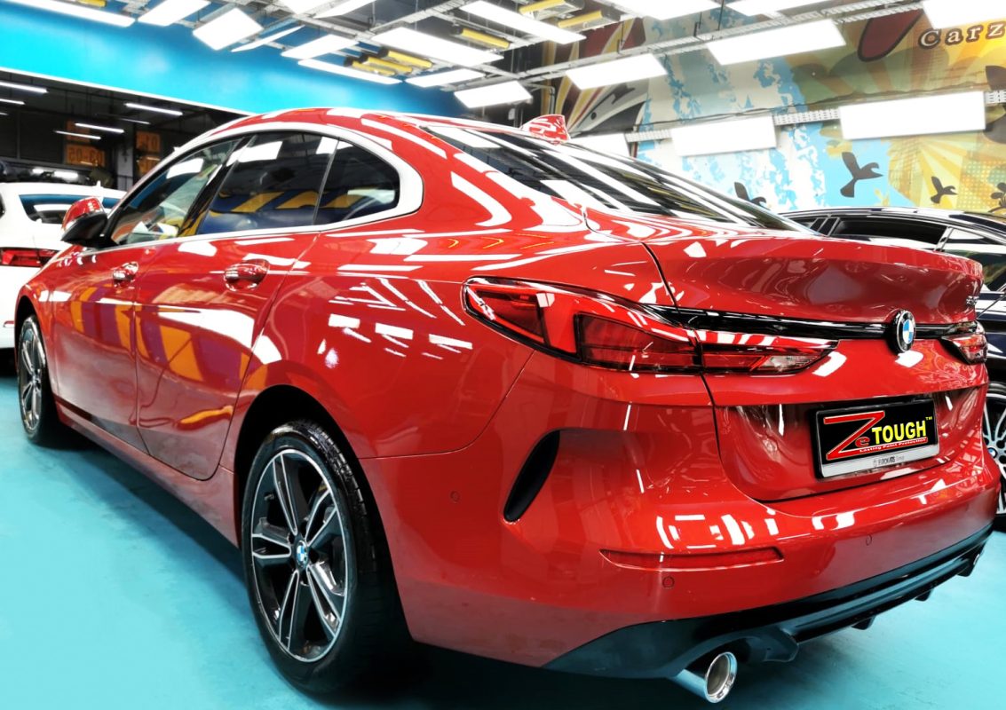 Rear quarter of the BMW 216i, glossy and protected.