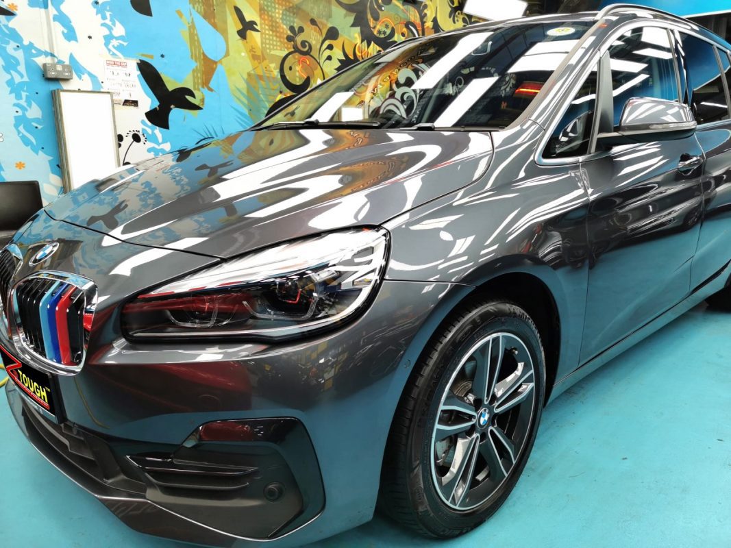 The BMW 218 from a side angle after the ceramic coating.