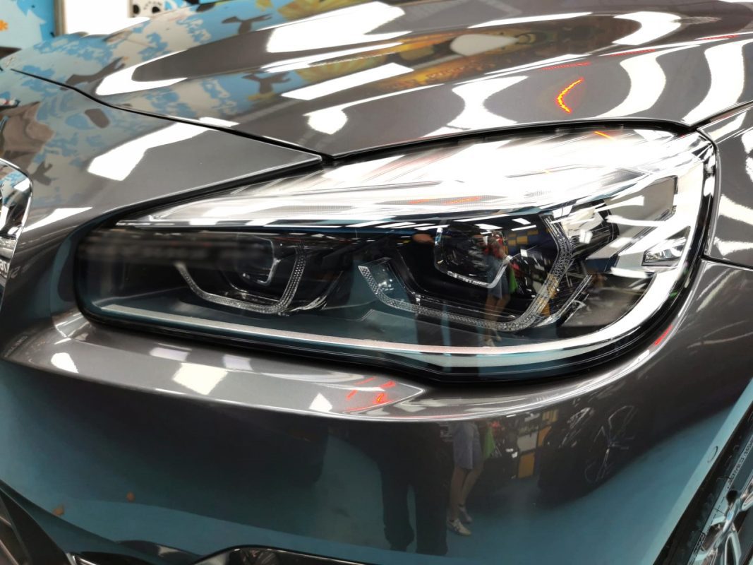 The 218's coated paintwork showing clean reflections.