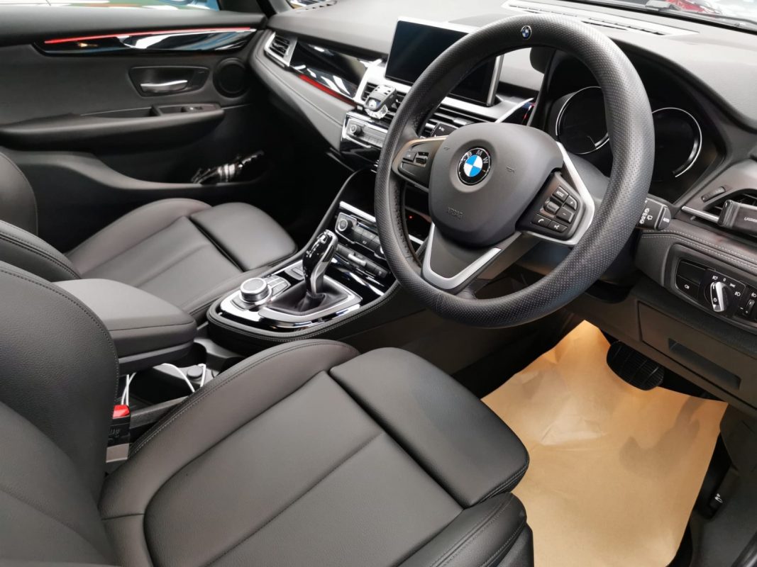 The BMW 218 parked in the workshop, freshly coated.