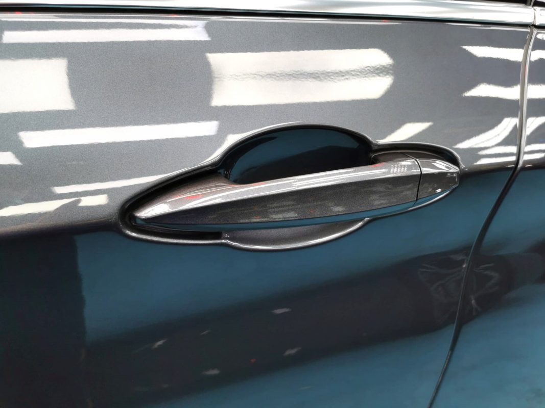 Front three-quarter view of the BMW 218 after coating.