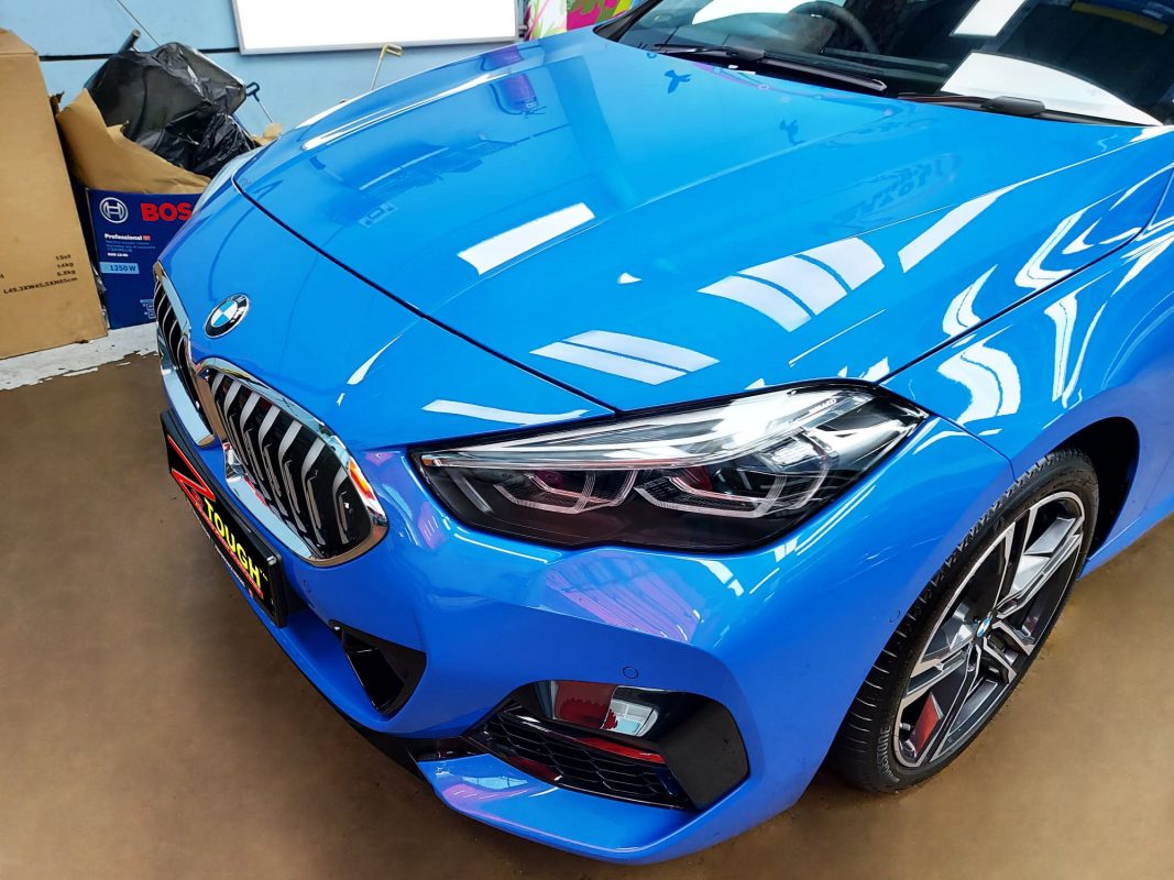 The BMW 218 from a side angle after the titanium coating.