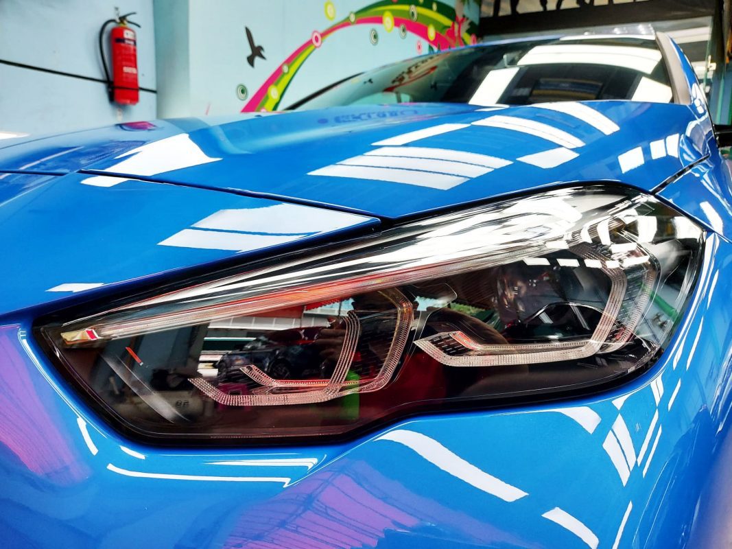The 218's coated paintwork showing clean reflections.