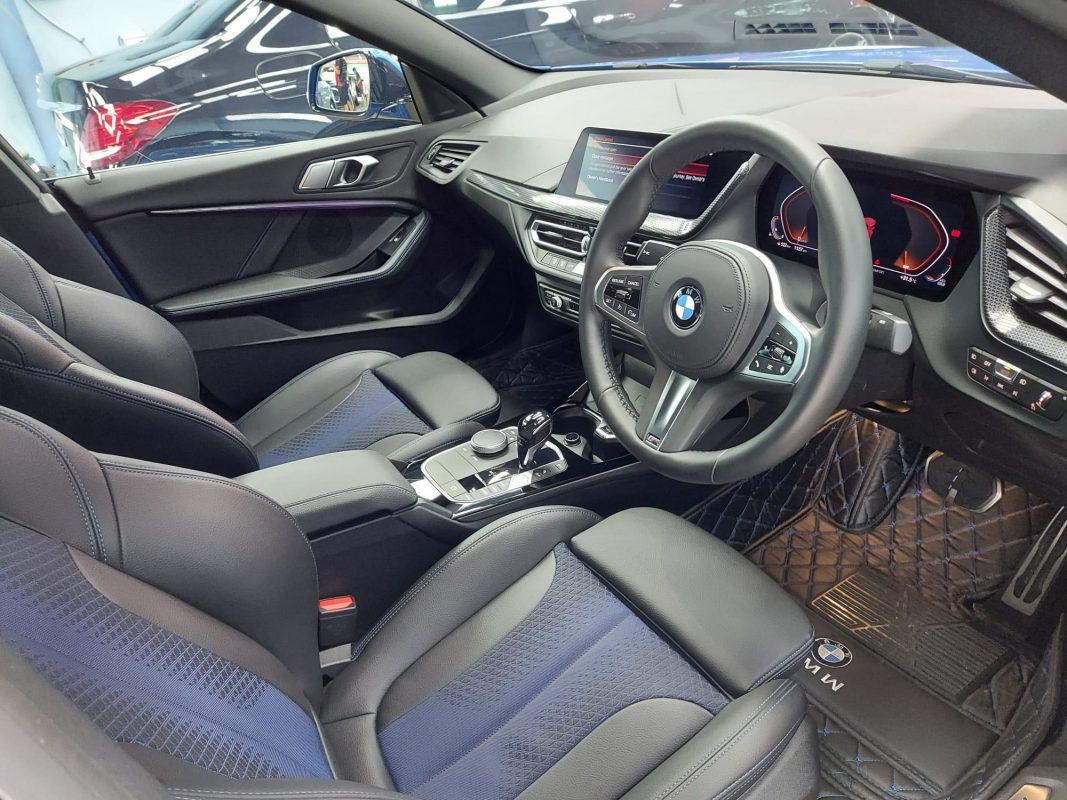 The BMW 218 parked in the workshop, freshly coated.