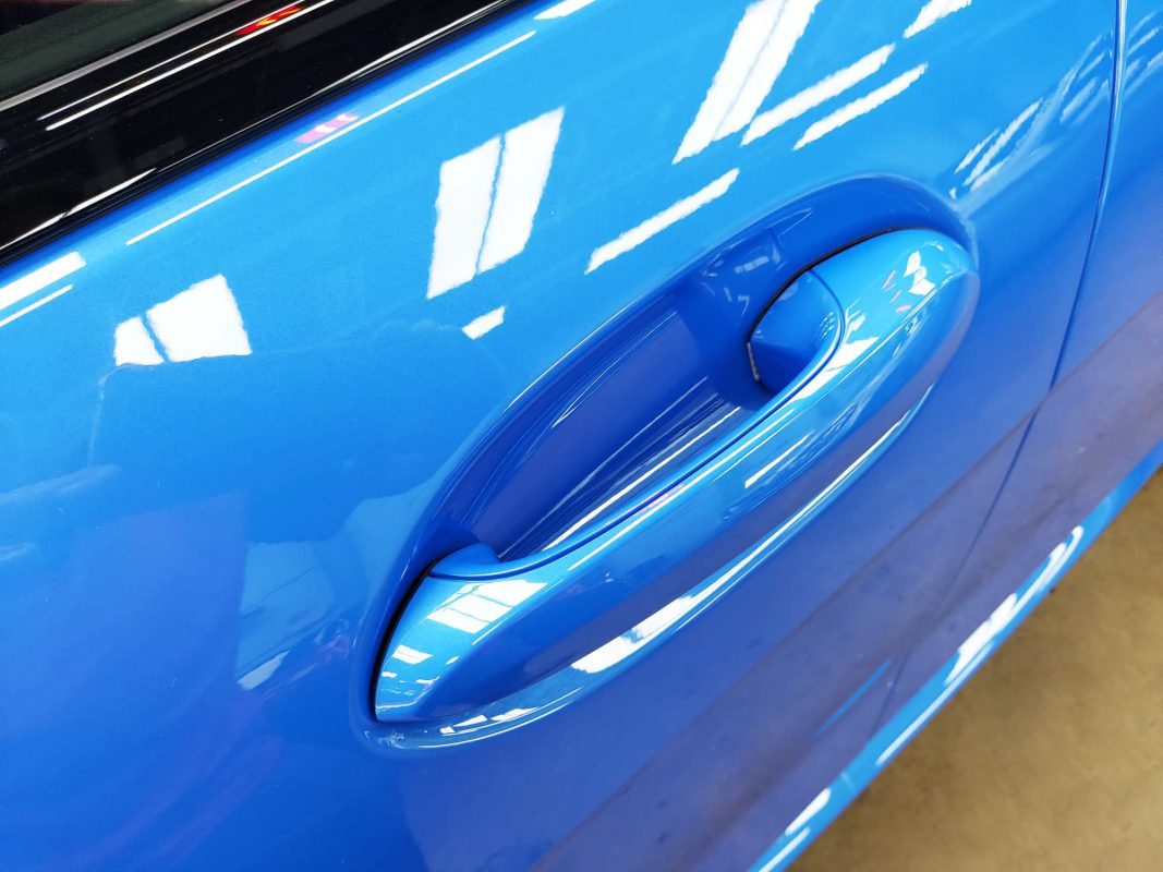 Front three-quarter view of the BMW 218 after coating.