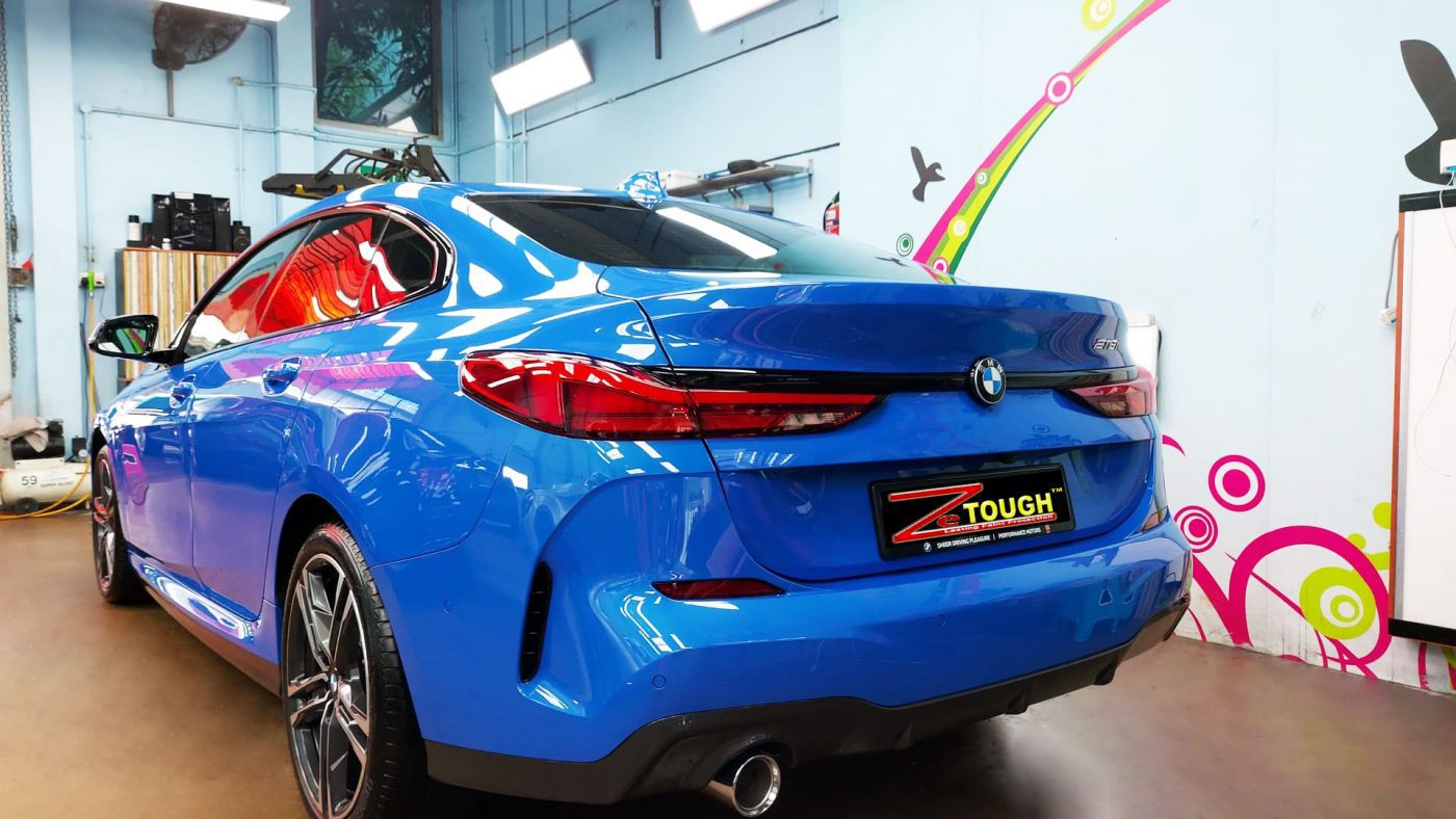 Rear quarter of the BMW 218, glossy and protected.