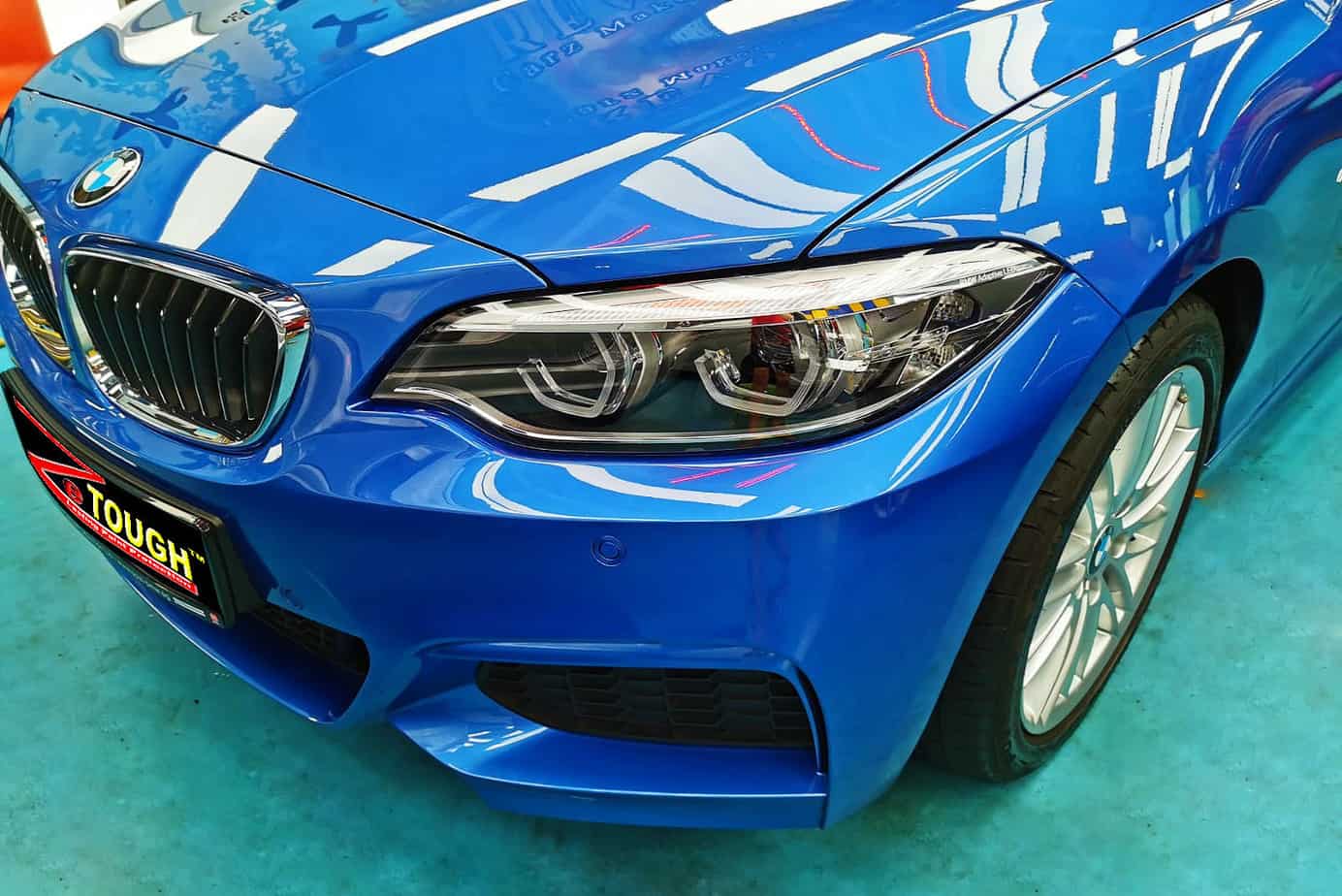 The BMW 218i from a side angle after the ceramic coating.