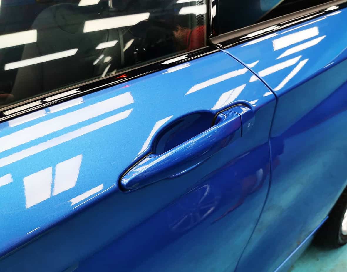 Front three-quarter view of the BMW 218i after coating.