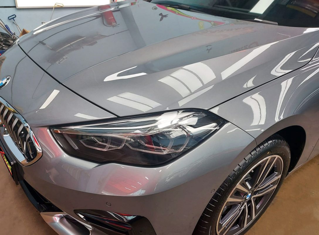 The BMW 218i GC from a side angle after the ceramic coating.