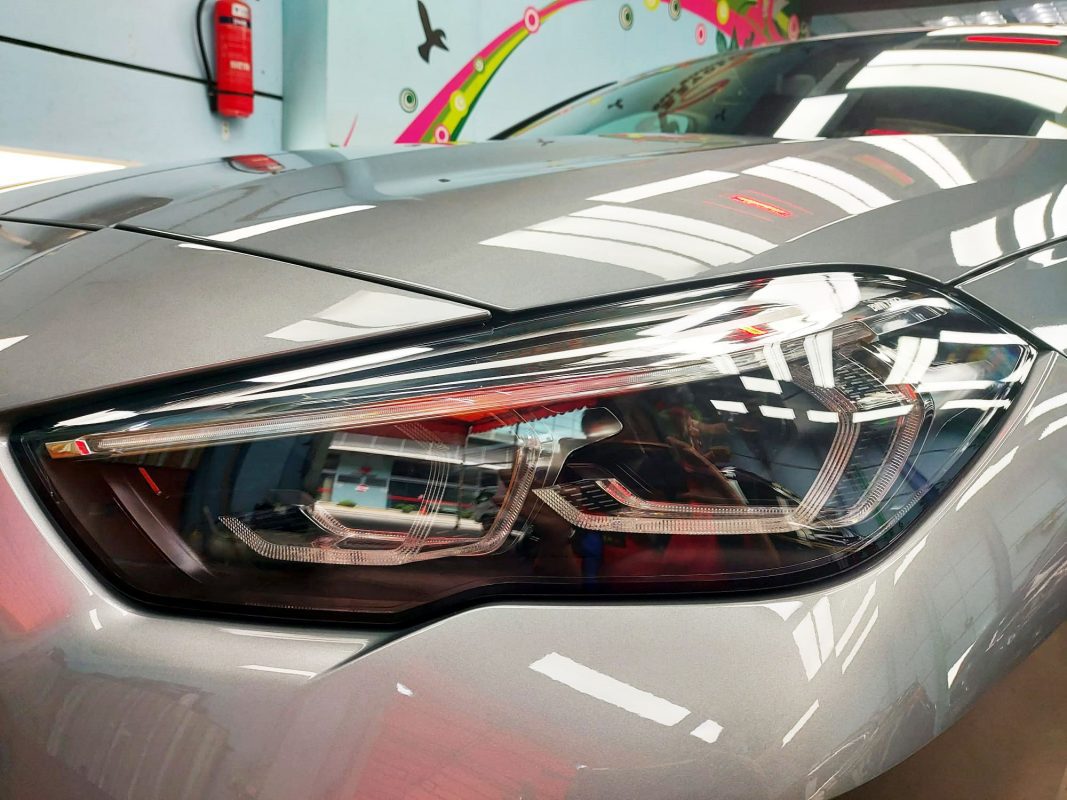 The 218i GC's coated paintwork showing clean reflections.