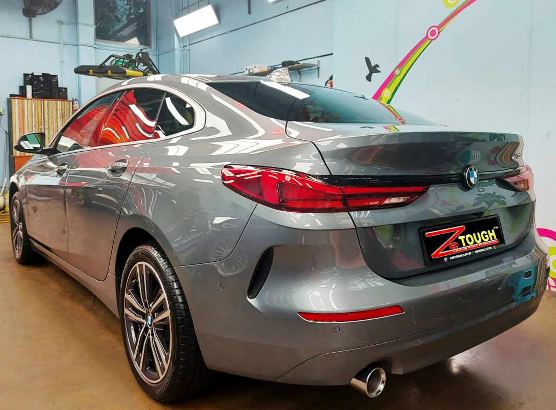 Rear quarter of the BMW 218i GC, glossy and protected.
