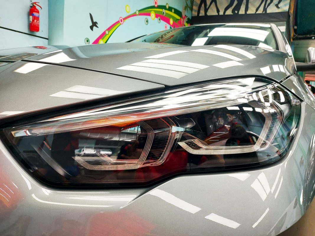 The 218i GC's coated paintwork showing clean reflections.