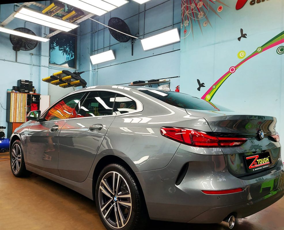 Rear quarter of the BMW 218i GC, glossy and protected.