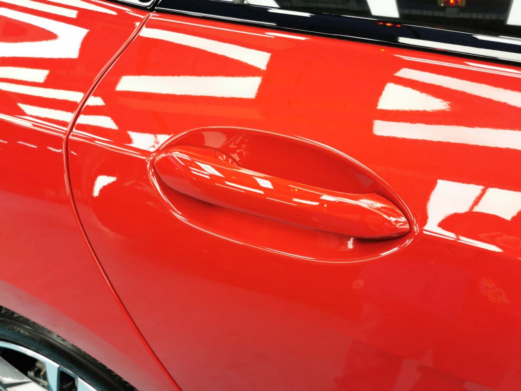 Front three-quarter view of the BMW 218i after coating.