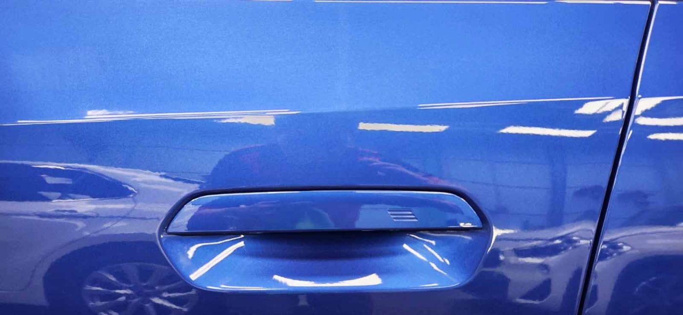 Front three-quarter view of the BMW 218i after coating.