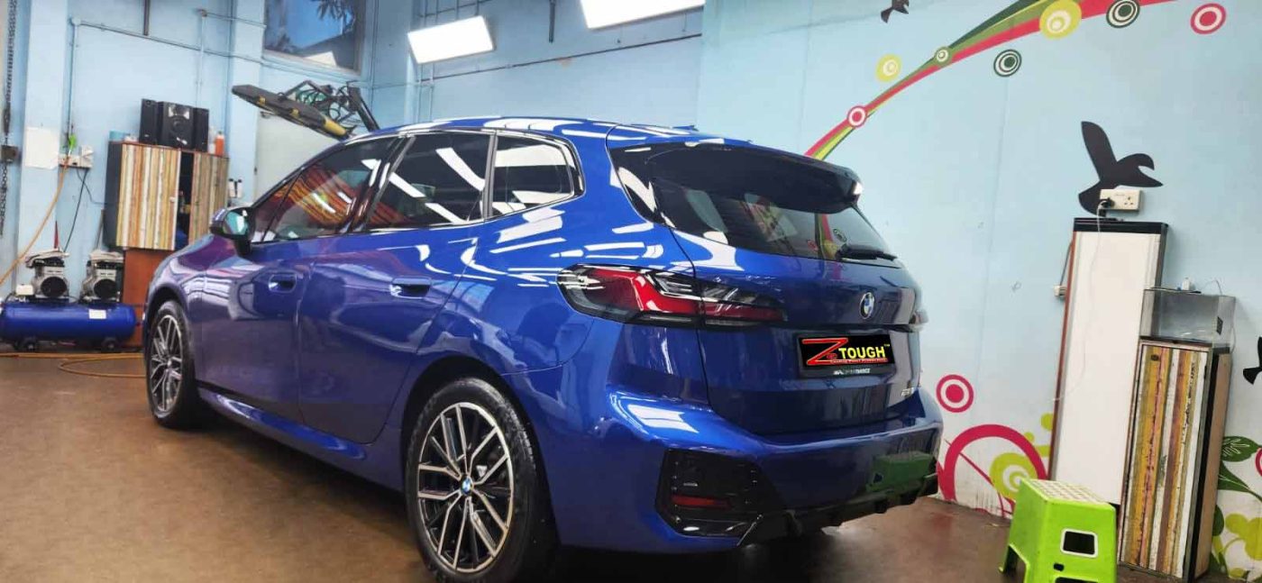Rear quarter of the BMW 218i, glossy and protected.