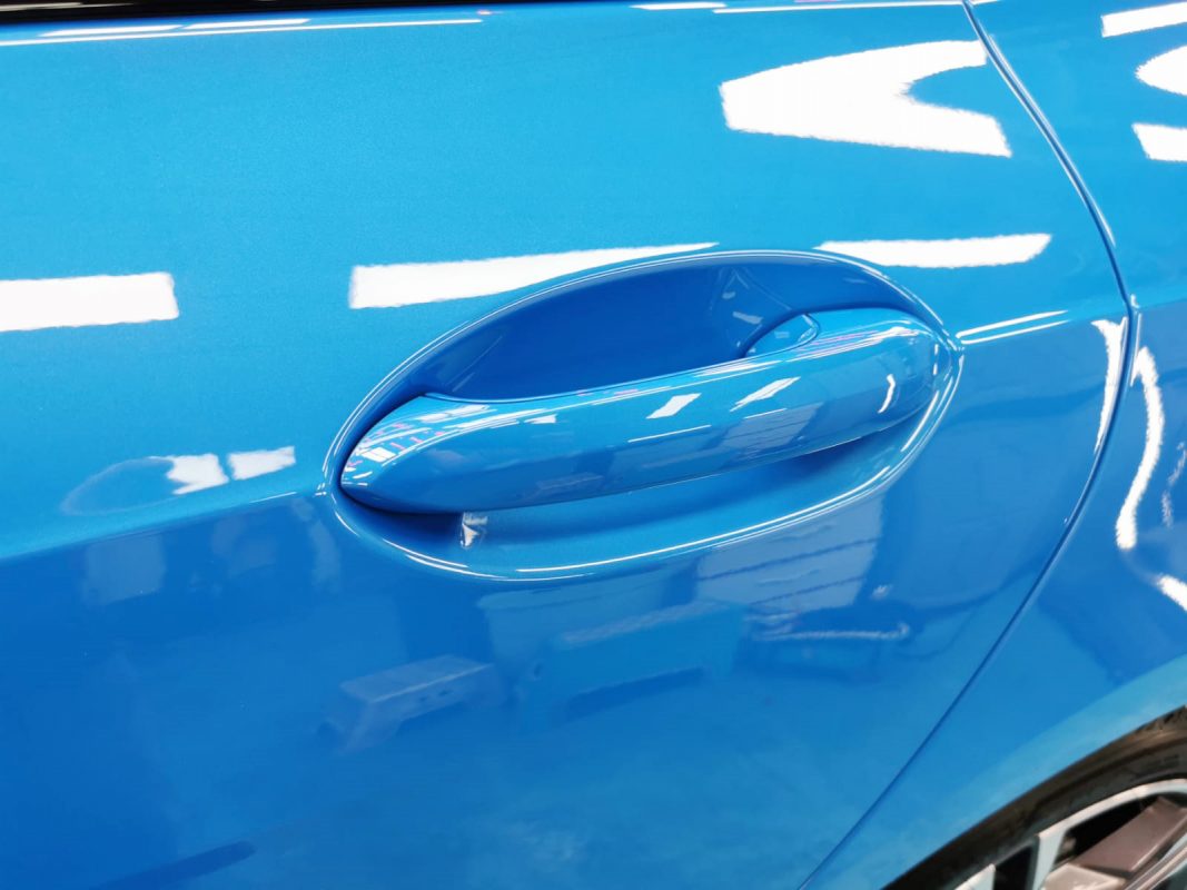 Front three-quarter view of the BMW 218i after coating.