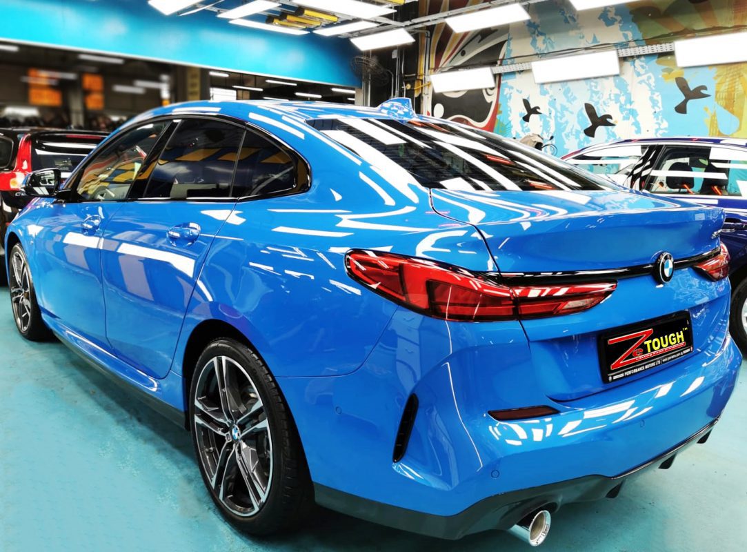 Rear quarter of the BMW 218i, glossy and protected.