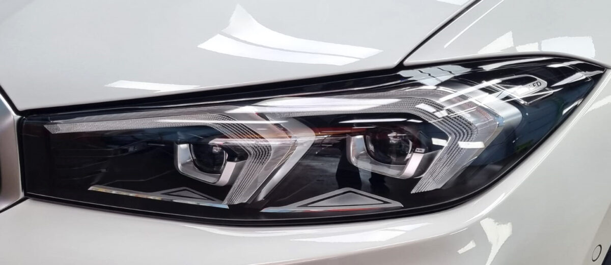 The 3 Series' coated paintwork showing clean reflections.