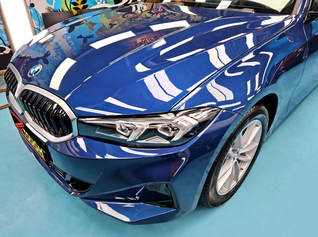 The BMW 3 Series from a side angle after the ceramic coating.