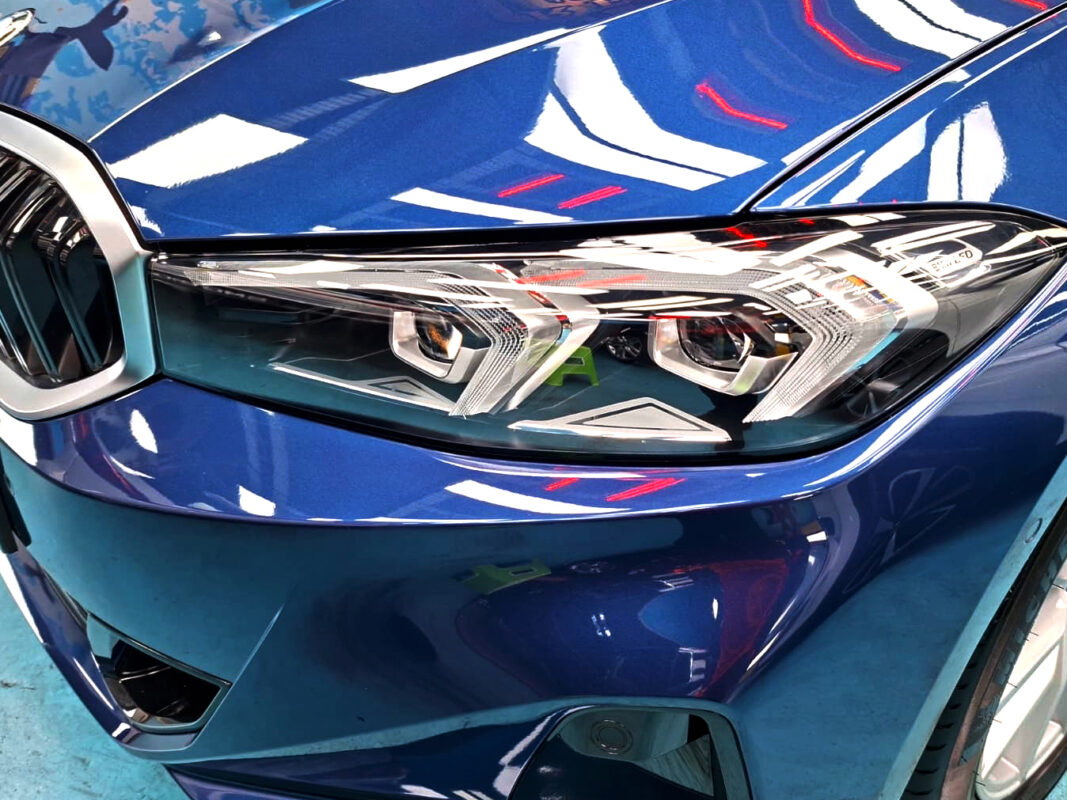 The 3 Series' coated paintwork showing clean reflections.