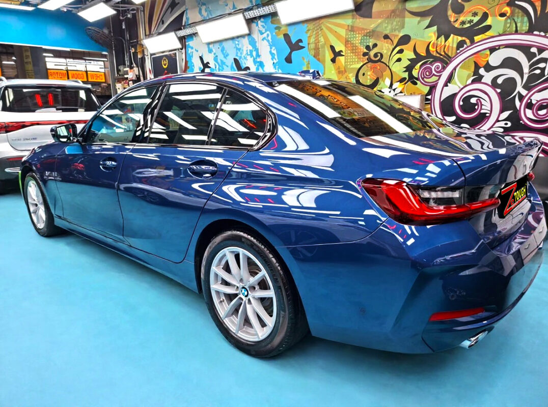 Rear quarter of the BMW 3 Series, glossy and protected.