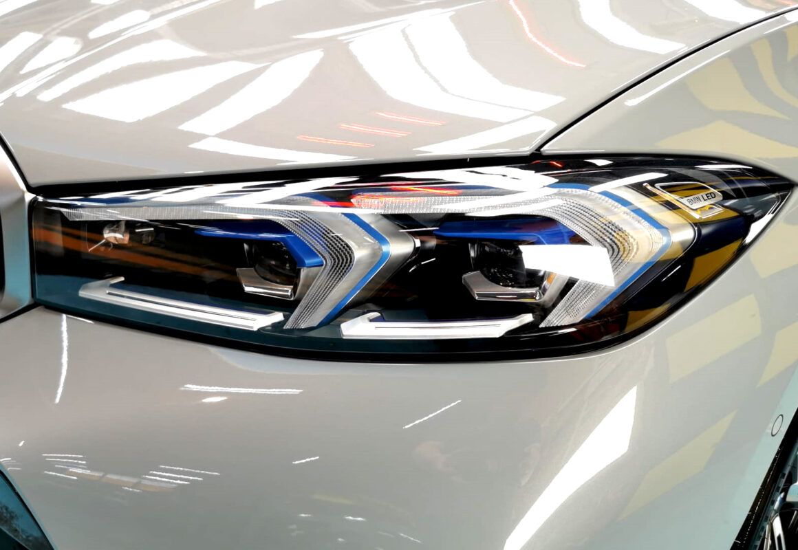 The 3 Series' coated paintwork showing clean reflections.
