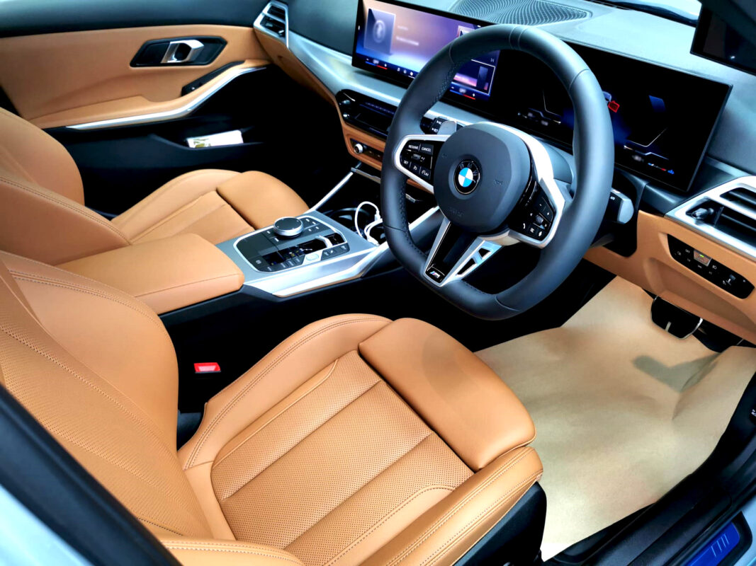 The BMW 3 Series parked in the workshop, freshly coated.