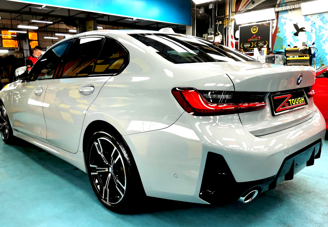 Rear quarter of the BMW 3 Series, glossy and protected.