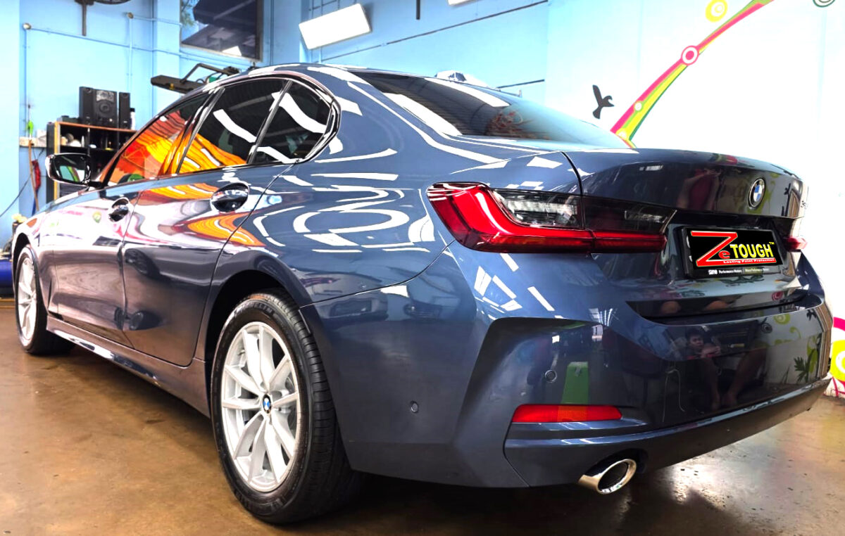 Rear quarter of the BMW 3 Series, glossy and protected.