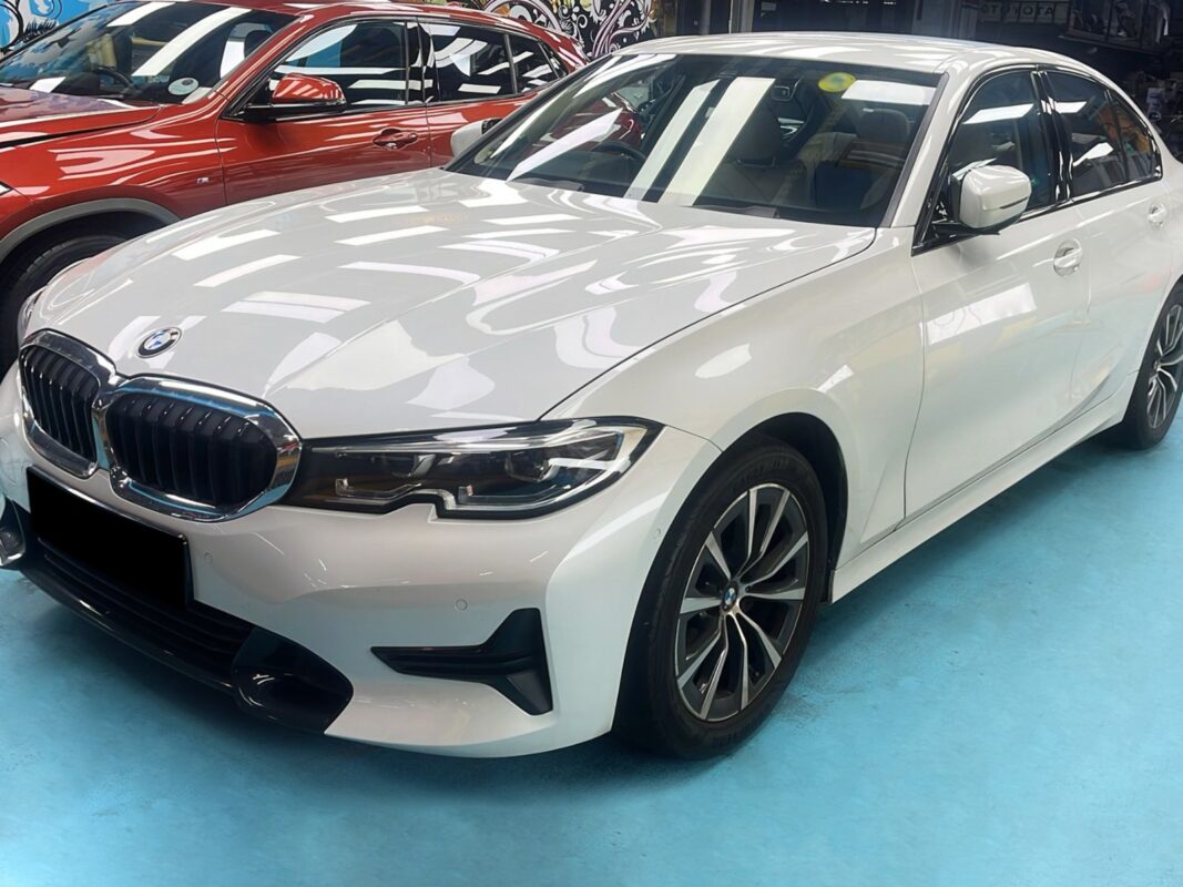 The white BMW 3 Series as it arrived at Revol Carz, before the respray.