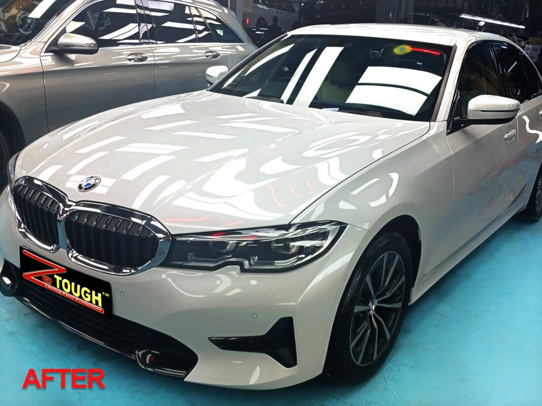 The BMW 3 Series headlight, clean and glossy after the work.