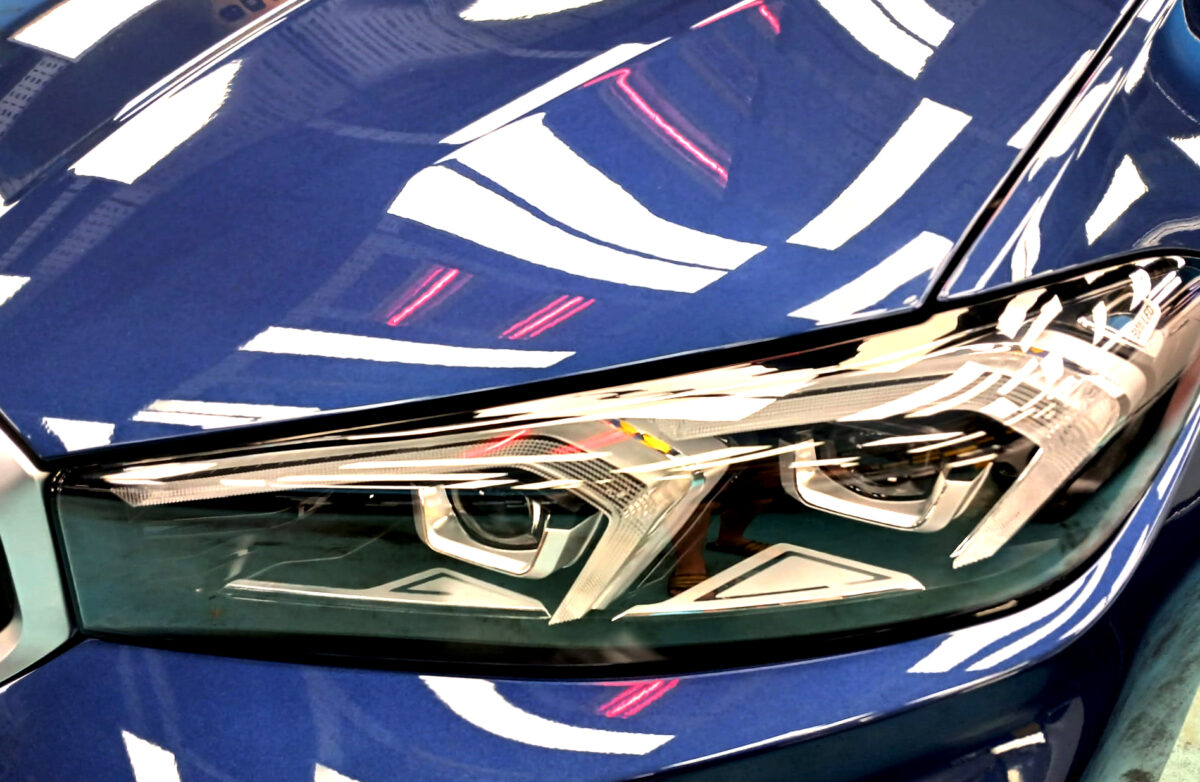 The 3 Series' coated paintwork showing clean reflections.