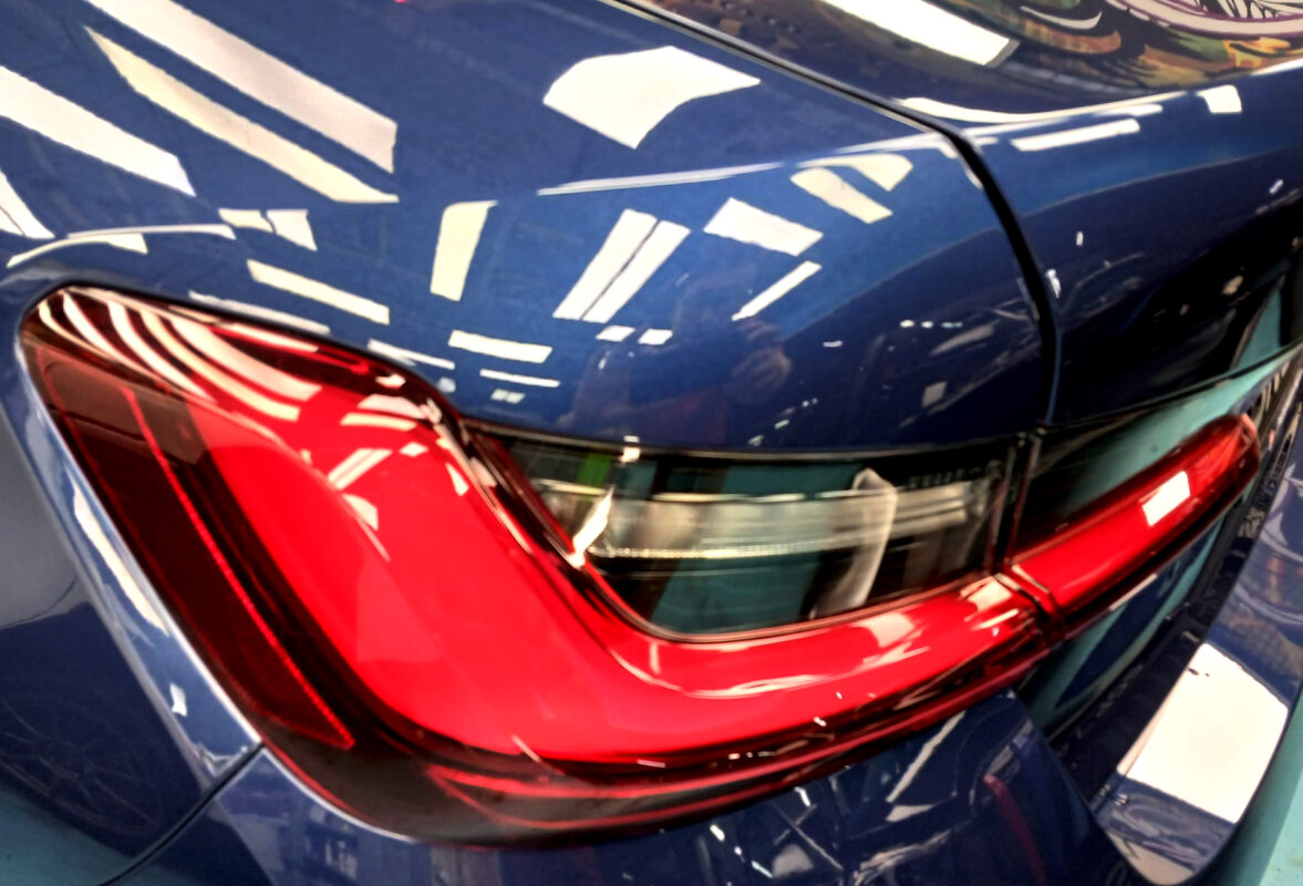 Rear quarter of the BMW 3 Series, glossy and protected.