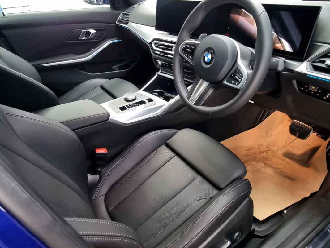 The 3 Series' coated paintwork showing clean reflections.