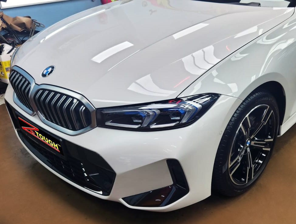 The BMW 3 Series from a side angle after the ceramic coating.