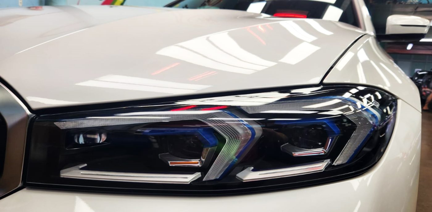 The 3 Series's coated paintwork showing clean reflections.