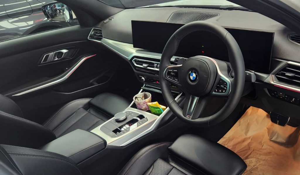 The BMW 3 Series parked in the workshop, freshly coated.