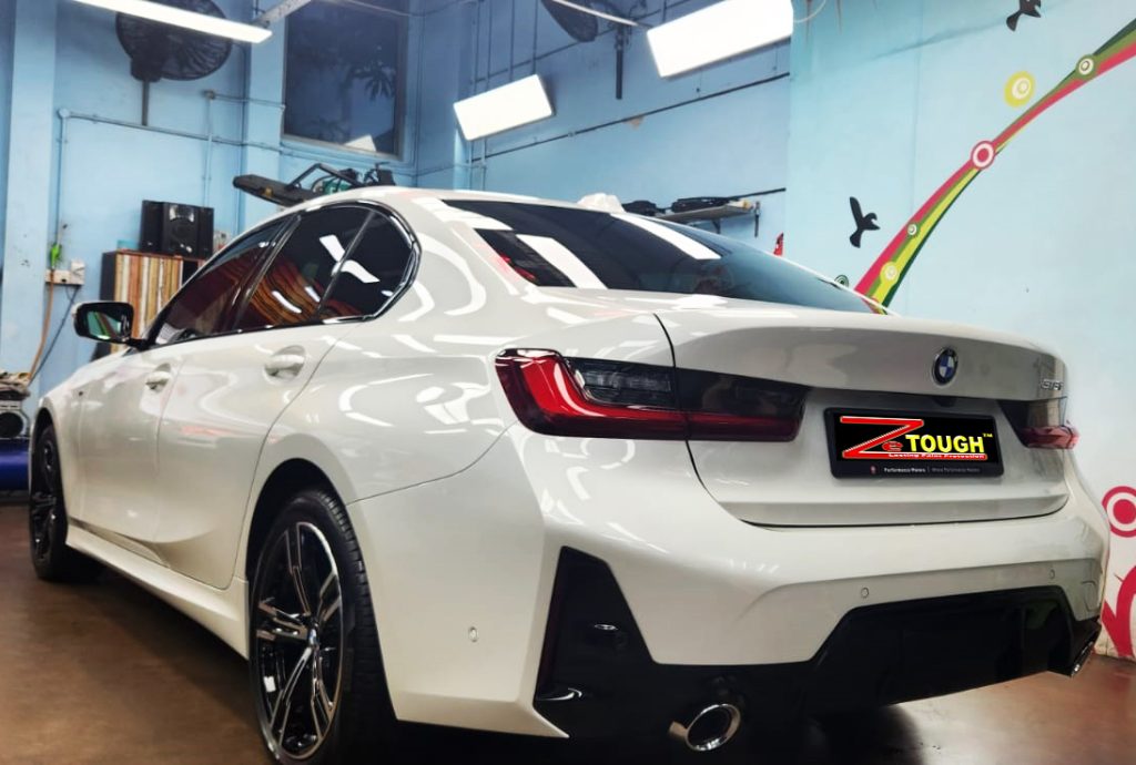 Rear quarter of the BMW 3 Series, glossy and protected.