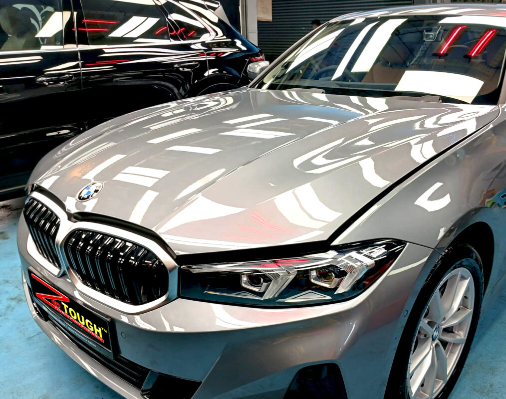 The BMW 3 Series from a side angle after the ceramic coating.