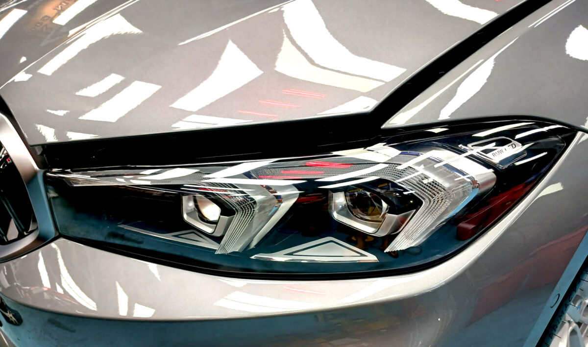 The 3 Series' coated paintwork showing clean reflections.