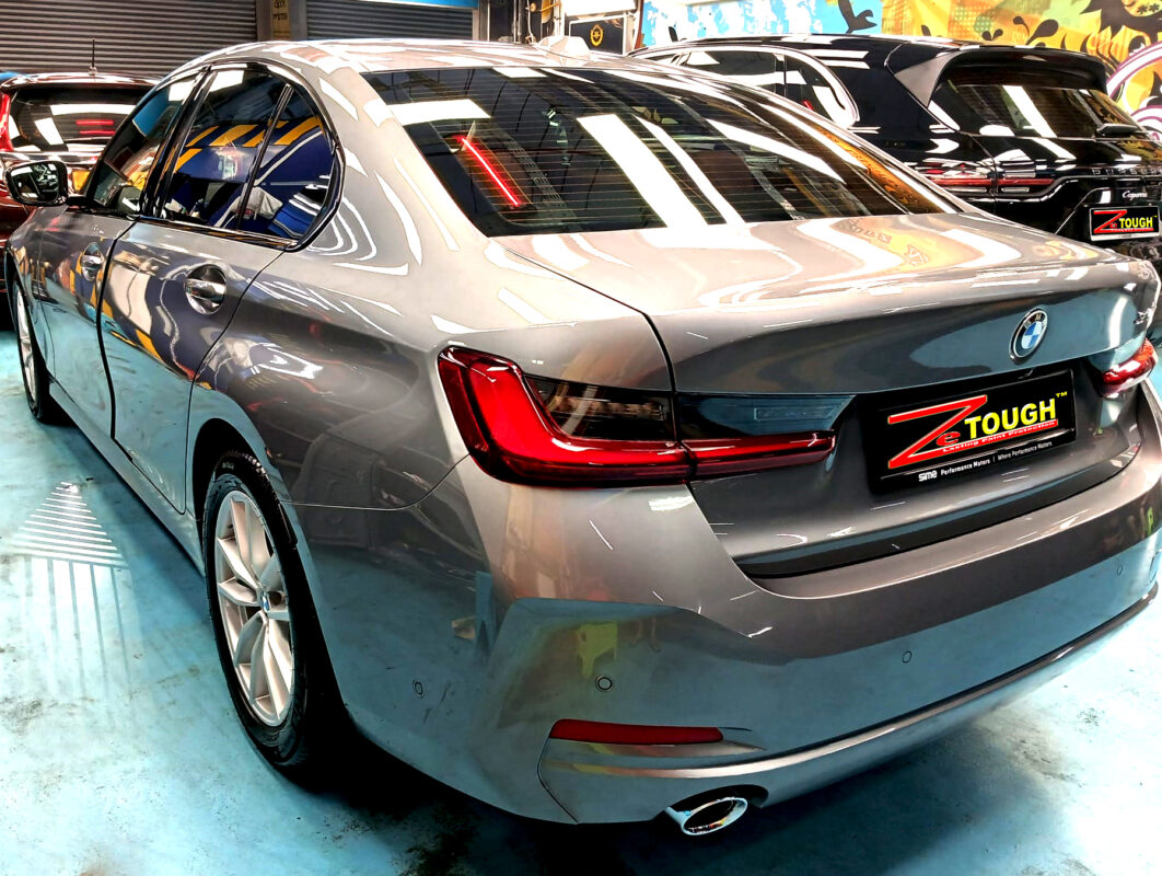 Rear quarter of the BMW 3 Series, glossy and protected.