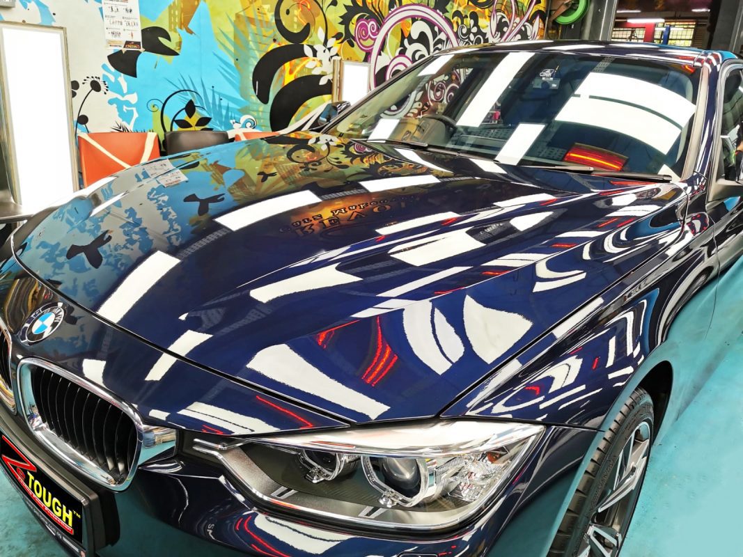 The BMW 316i from a side angle after the ceramic coating.
