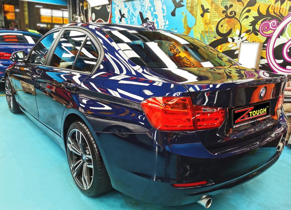 Rear quarter of the BMW 316i, glossy and protected.