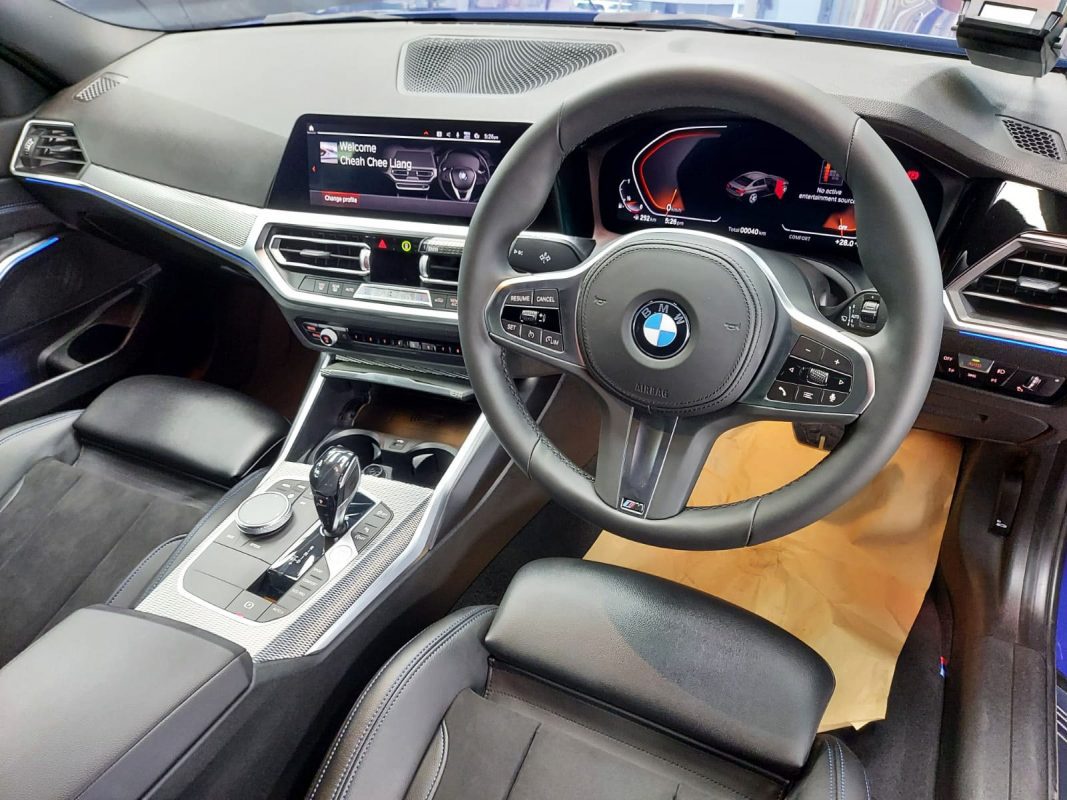 The BMW 318 parked in the workshop, freshly coated.